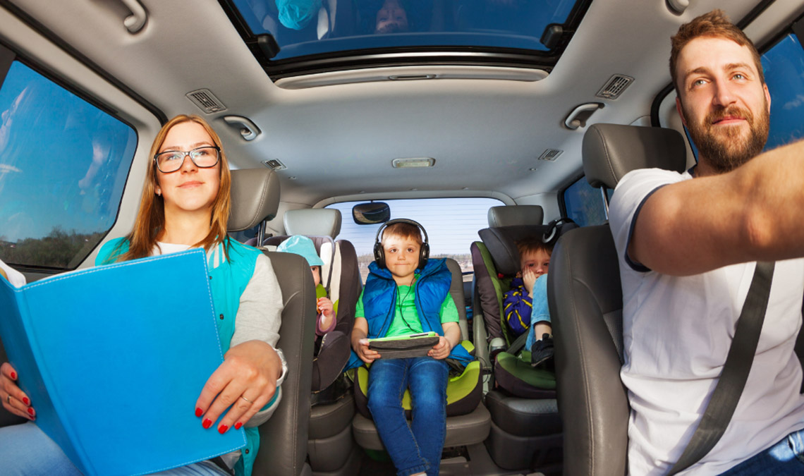 Kids and parents traveling by rental car